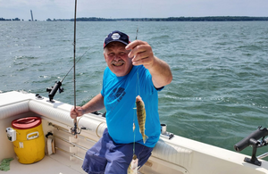 Happy Angler In Lake Erie, perch 2 @ a time !